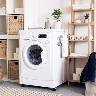 A washing machine in a laundry room.
