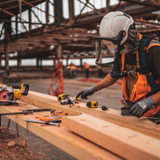 A carpenter working with timber.